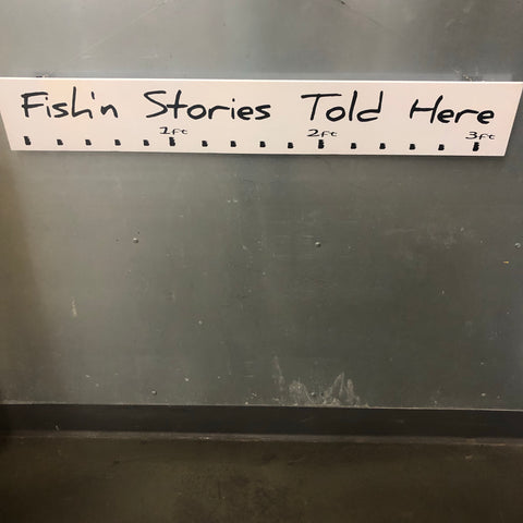“Fishing Stories Told Here” Sign